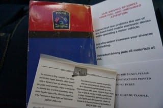 The statutes regulating traffic laws, and some of the handouts given to cellphone and distracted driving offenders. Photo credit: Ronni Newton.