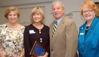 Donna Namnoum, second from left, received The Bridge Family Center's "Build No Fences" Award. She is pictured with (from left) Bridge Director of Community Services Judy Bierly, her husband Bob Namnoum, and Bridge Executive Director Margaret Hann. Submitted photo.