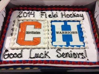 Shared cake honoring Conard and Hall field hockey seniors. Photo from Twitter @WHallHigh