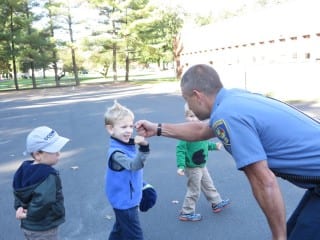 A West Hartford firefighter greets a students at Lollipop Tree Nursery School during a Fire Prevention Week visit. Submitted photo.