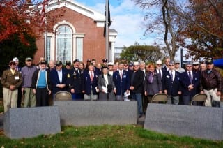 Veterans and families of veterans pose for a group photo following the 2014 West Hartford Veterans Day Ceremony at Connecticut Veterans Memorial. Photo credit: Ronni Newton