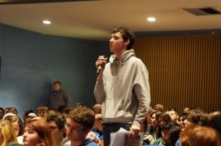 A Hall student asks a question during an International Human Rights Day panel discussion. Photo credit: Ronni Newton