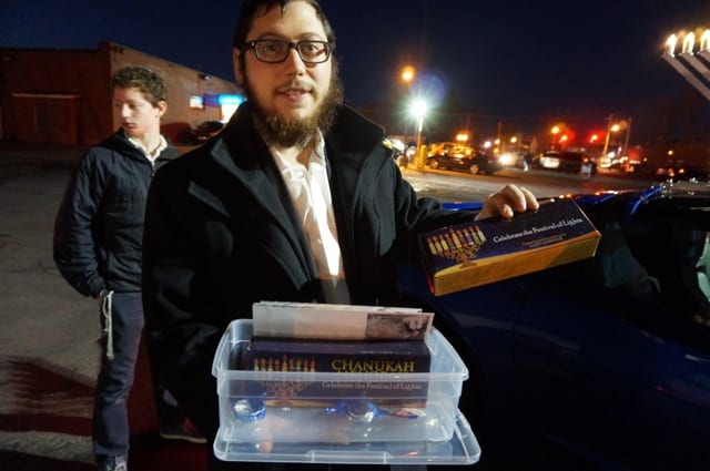 'Chanukah kits,' which include a menorah, candles, dreidel, and chocolate coins, will be handed out along the parade route. Photo credit: Ronni Newton