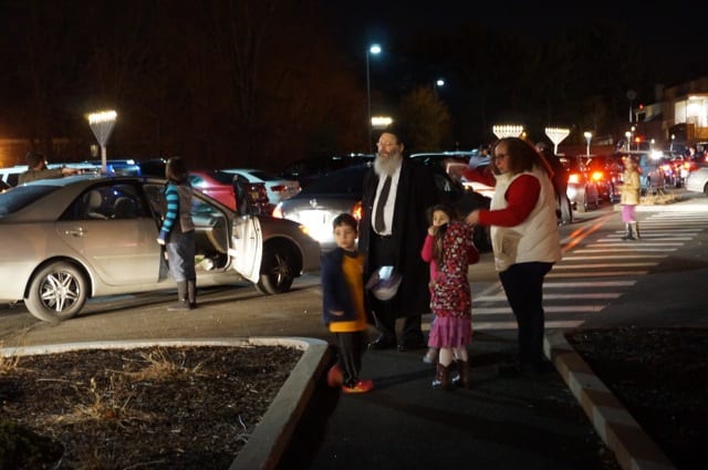 The Chanukah Parade passes by Anytime FItness as it proceeds from the Crown Supermarket parking lot in Bishops Corner heading toward West Hartford Center. Photo credit: Ronni Newton
