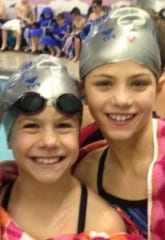 Waves swimmers Julia Seguro (L) and Cate Mancini won their events and ear