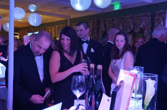 Guests bid on silent auction items. Children's Charity Ball, West Hartford, Jan. 17, 2015. Photo credit: Ronni Newton