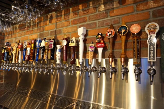 Beer taps as far as the eye can see. World of Beer in West Hartford has over 50 beers on tap, and the selections change daily. Photo credit: Ronni Newton