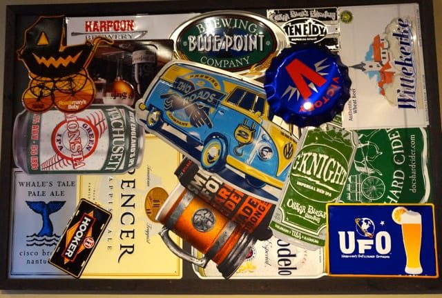 Tin tackards decorate the walls. World of Beer, West Hartford, CT. Photo credit: Ronni Newton