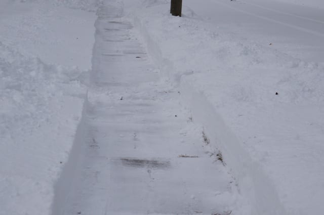 Snow blowers create a clear swath on the sidewalk. West Hartford, Blizzard of 2015. Photo credit: Ronni Newton
