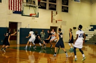 #23 Ike Udeh, captain on the Hall team, sinks a 3 pointer against Simsbury on Jan. 6. Photo by Joy Taylor