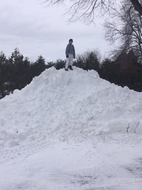 Michael Weiss at the top of a snow hill at Conard High School Tuesday afternoon. Photo courtesy of Danielle Weiss