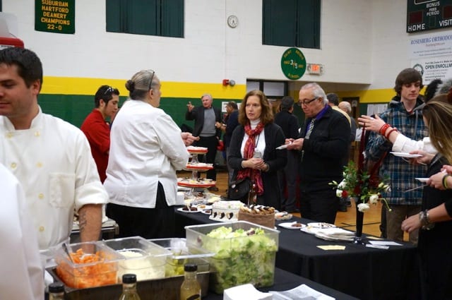Chamber of Commerce Executive Director Barbara Lerner and her husband Hank sample the offerings from Classic Cakes. Taste of Elmwood, Feb. 5, 2015. Photo credit: Ronni Newton