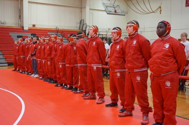 Conard wrestlers line up before the ceremony honoring former coach George Beaudry. Photo credit: Ronni Newton