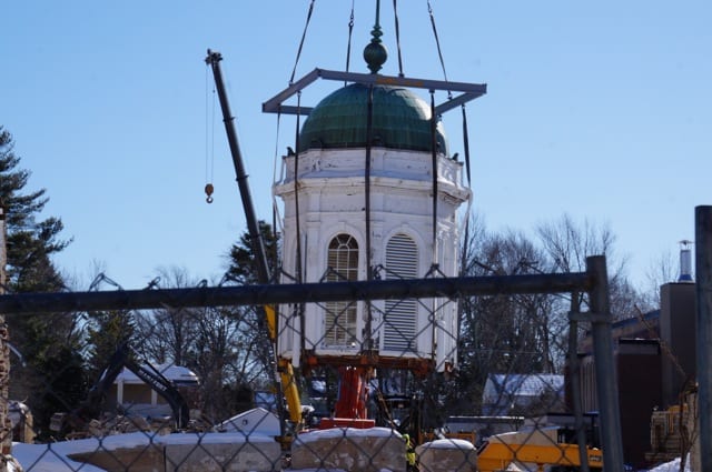 The crane lowers the cupola onto a flatbed truck. Photo credit: Ronni Newton