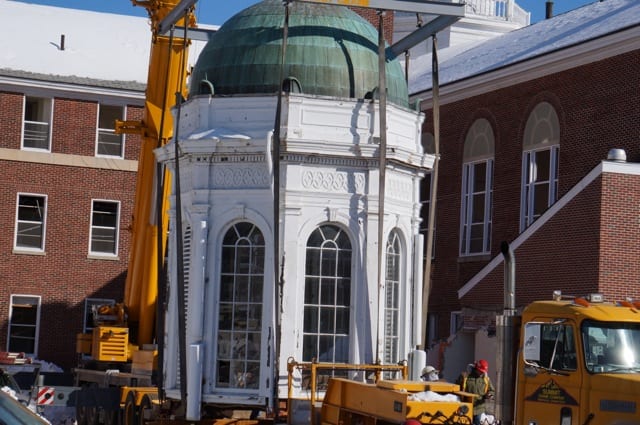 The crane lowered the cupola onto a flatbed truck, and it will be transported across the parking lot to the Executive Director's house where it will be temmporarily stored. Photo credit: Ronni Newton