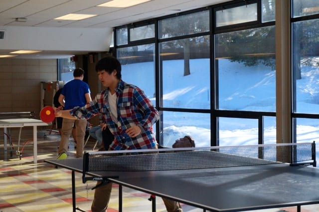 Jason Trieu from Conard. Conard vs. Hall inaugural ping pong tournament. Photo credit: Ronni Newton