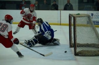 Conard's third goal is scored by Mark Ehnot. Conard vs. Hall/Southington hockey, Feb. 23, 2015. Photo credit: Ronni Newton