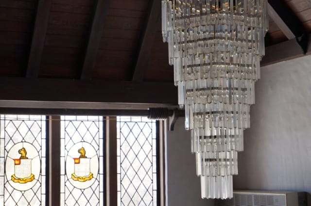 Chandelier and cathedral windows in the foyer. 2015 Junior League of Hartford Decorator Show House. Photo credit: Ronni Newton
