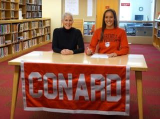 Elena Santos (right) with her mom, Lisa Audet, at the signing ceremony. Photo credit: Ronni Newton