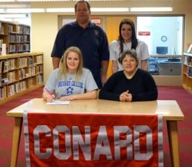 Elise Youmans (left, seated) and her family at the signing ceremony at Conard. Photo credit: Ronni Newton