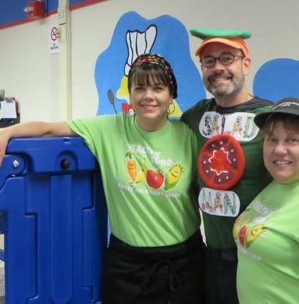 salad bar man with cafeteria workers