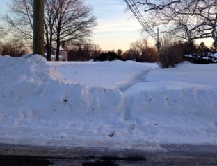 This sidewalk near an elementary school in West Hartford was shoveled after the most recent snowfall, but not all the way to the curb cut. Photo credit: Ronni Newton