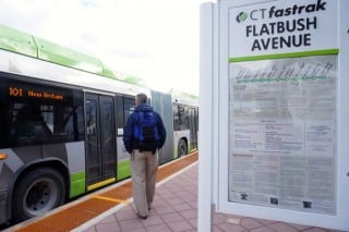 Doug Hamilton, who works at Realgy Energy Services in West Hartford, board the CTfastrak bus at the Flatbush Ave. station to ride home to Berlin on Monday. Photo credit: Ronni Newton