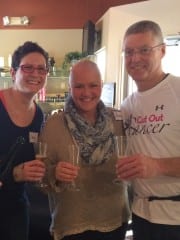 A sparkling cider toast by (left to right) Carey Penney, Paula Jacobs, and Barry Wixsom (massage therapist) at the Cut Out Cancer anniversary celebration. Submitted photo