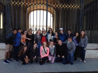 Seventeen Kingswood Oxford students and two teachers pause in front of the Royal Palace in Madrid, before competing in the 28th annual Harvard Model Congress Europe conference on Mar. 14-16. Submitted photo