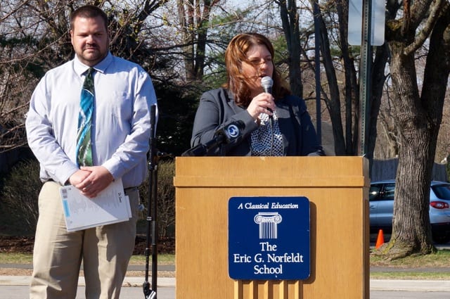 Norfeldt Principal Jen Derick (right) speaks to the Norfeldt community about reducing, reusing, and recycling at the school's first Earth Day celebration. At left is Curriculum Specialist Chris Weaver. Photo credit: Ronni Newton