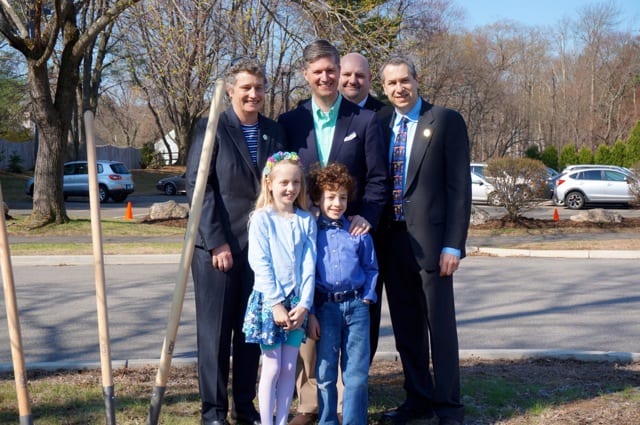 (Front row, from left): First graders Sophia Fiskewold and Sam Lewis pose with (back row, from left) State Sen. Beth Bye, West Hartford Mayor Scott Slifka, Superintendent of Schools Tom Moore, and State Rep. Brian Becker following the Earth Day tree planting. Photo credit: Ronni Newton