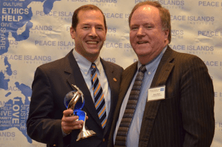 State Rep. Andy Fleischmann (left) receives the Statesman of the Year Award, standing with Rep. Kevin Ryan. Courtesy photo