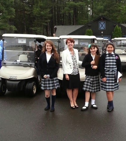 Hickey students in front of golf carts