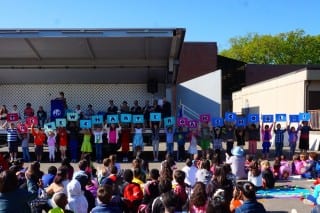When the placards were turned over, they spelled out "The New Charter Oak School." Photo credit: Ronni Newton