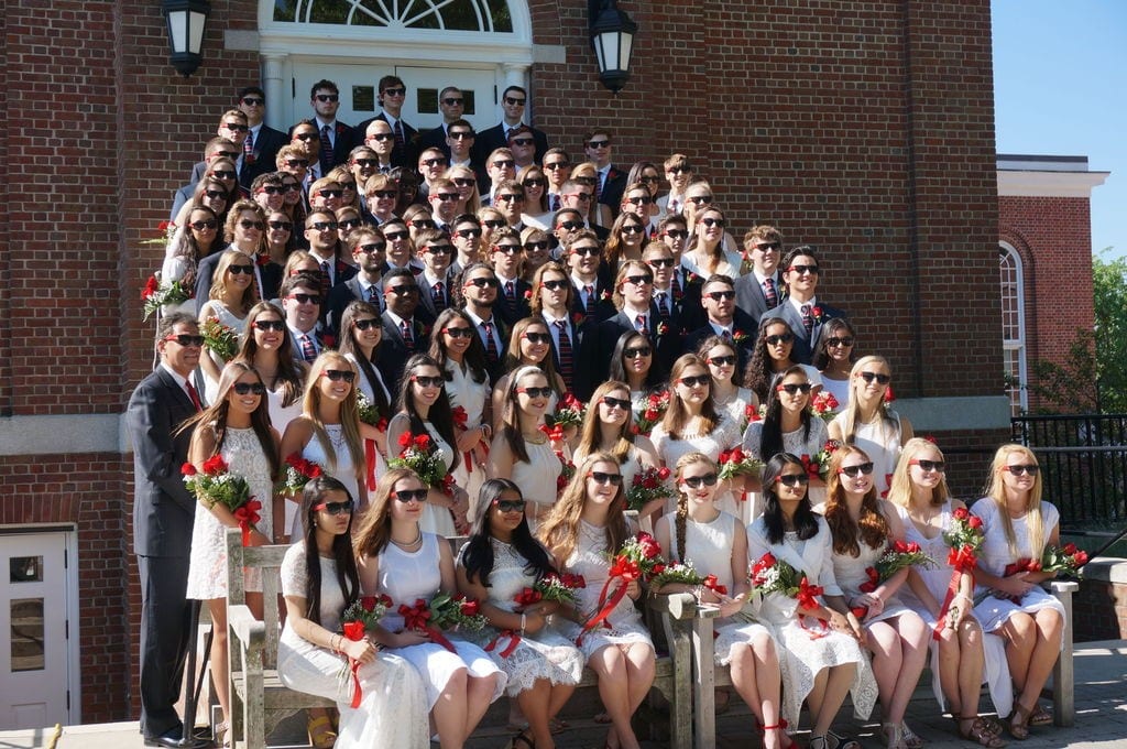 Their surprise swag – KO sunglasses – came in handy for Kingswood Oxford’s 91 seniors when they assembled on the steps of Alumni Hall for their traditional class photo. Photo by Michelle Murphy