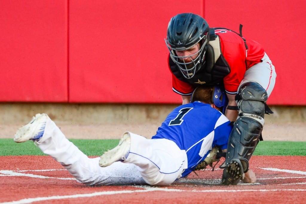 Hall's Neil Kelley attempts to steal home and is tagged out at the plate by Conard catcher Henry Fracasso. Photo courtesy of Andrew Stabnick, LowTide Photography