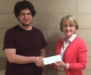 Submitted photo: Michael Terranova from Conard High School receives the 2015 WHWC Scholarship from Sheila, Nussbaum, WHWC Board member