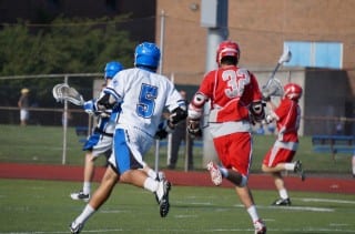 Conard's Luke Garneau (#32) had a double hat trick in Thursday's game against crosstown rival Hall. Photo credit: Ronni Newton