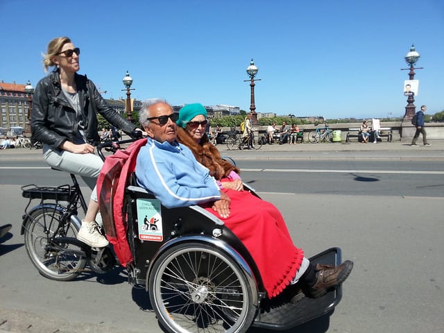 An elderly couple in Denmark enjoys a ride in a specialized rickshaw. Courtesy photo