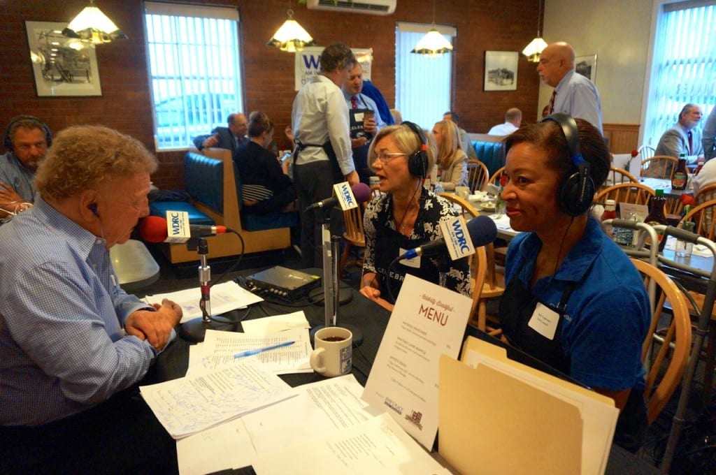 Brad Davis interviews Minority Leader Denise Hall (left) and Town Council member Judy Casperson on his morning show broadcast from Effie's Place. Celebrity Breakfast. June 9, 2015. Photo credit: Ronni Newton