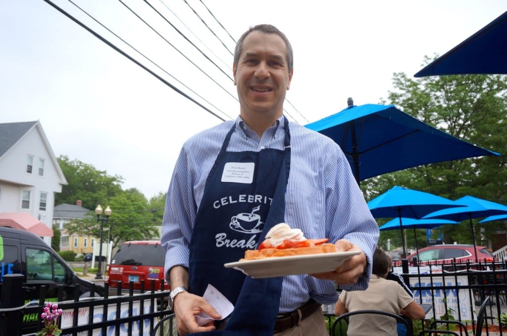 State Rep. Brian Becker serves Whiting Lane Waffles on the patio. Celebrity Breakfast. June 9, 2015. Photo credit: Ronni Newton