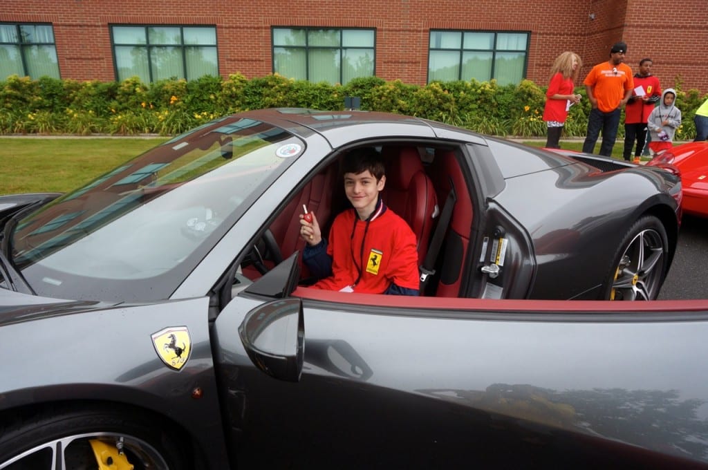 Before going for a ride, David Newman of West Hartford checks out the driver's seat of Harold Kirstein's Ferrari 458 Spider. Concorso Ferrari & Friends, June 28, 2015. Photo credit: Ronni Newton