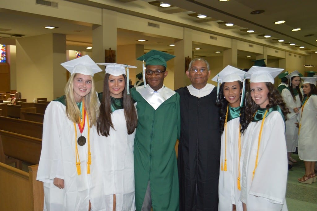 Northwest Catholic 2015 graduates celebrate with their teacher. Anna Case of Glastonbury, Gabriella Giannone of West Hartford, Ramone Clahar of Hartford, Deacon Jeffrey Sutherland of Bloomfield, Angela Miguel of Newington and Charlotte Carew of Simsbury share a moment as they prepare for their graduation ceremony at the Cathedral of St. Joseph. Submitted photo