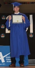 Gabriel Little shows off his diploma from IEA. Submitted photo