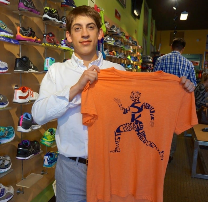 Conard High School junior Andrew Hollerbach shows off his winning design for the 2015 Celebrate West Hartford Road Race t-shirt. Photo credit: Ronni Newton