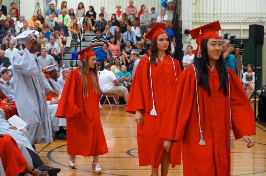 From left: Madison Hyland, Rosalynn Hyatt, and Xuan Kim Huynh. Conard High School graduation. June 15, 2015. Photo credit: Ronni Newton