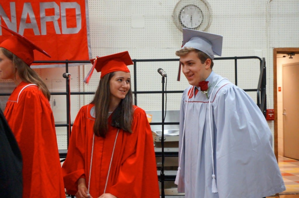 Maggie Jamin followed by Mary Jastrzebski and Nate Jeremiah. Conard High School graduation. June 15, 2015. Photo credit: Ronni Newton