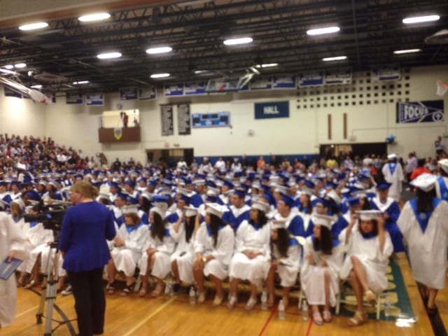 Students watch as their peers receive their diplomas. Photo by Katie Cavanaugh.