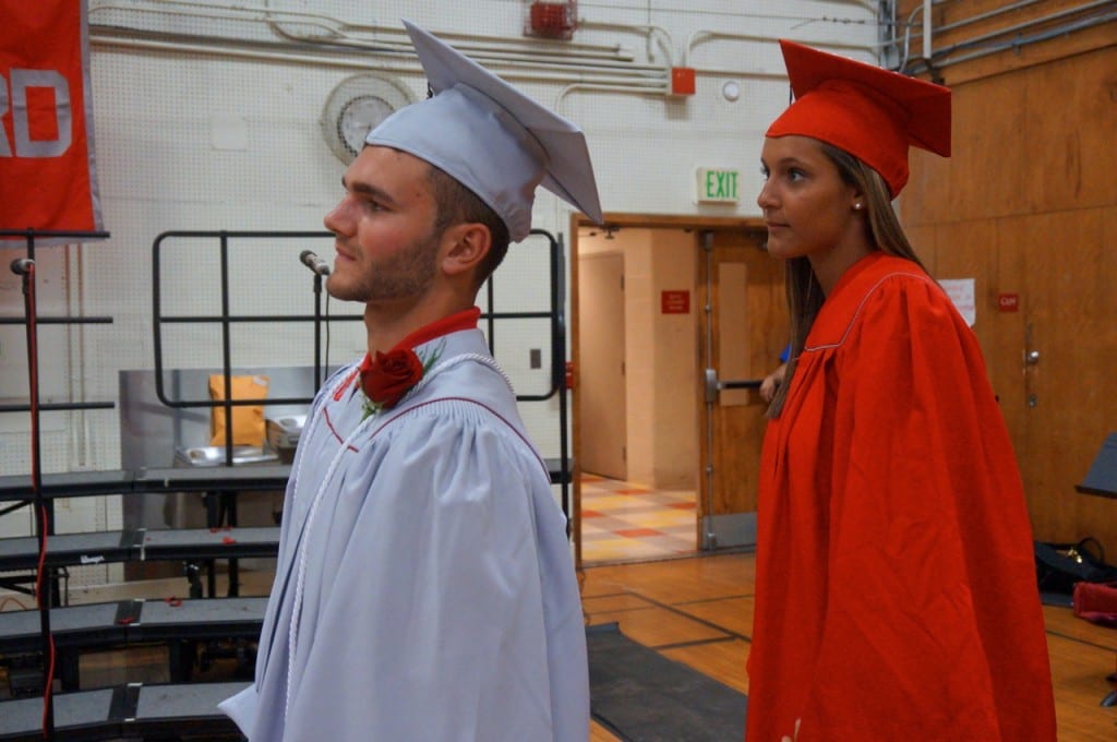 Brian Santoro and Elena Santos line up to receive their diplomas. Conard High School graduation. June 15, 2015. Photo credit: Ronni Newton