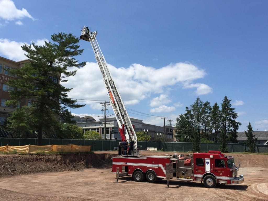 The West Hartford Fire Department's Quint 3 was used to rescue the sick, possibly poisoned, baby hawk from the pine tree on the Delamar West Hartford Hotel construction site. Photo credit: Ronni Newton